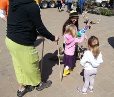 Dakota teaches children about puppets. 